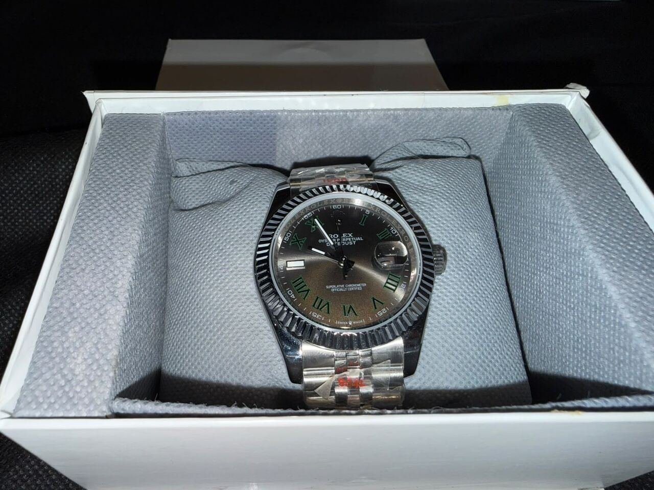 SAR 1550, Rolex Datejust 41, Featuring A Fluted Bezel, Silver Dial With Roman Numerals, And A Jubile