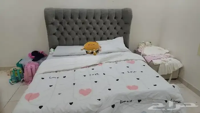 Bed with mattress and dining table